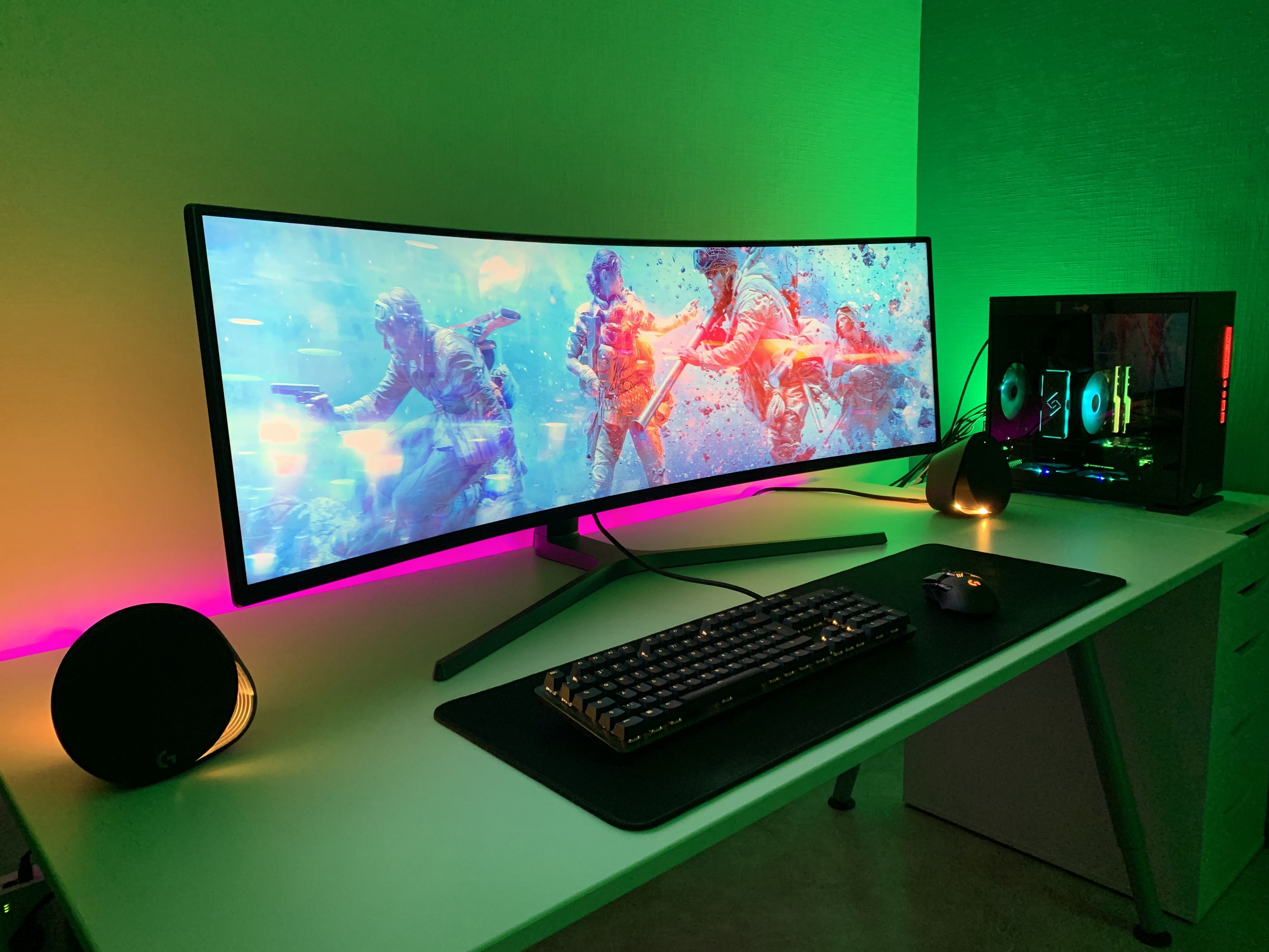 Game testing lab with multiple monitor setups and benchmarking tools